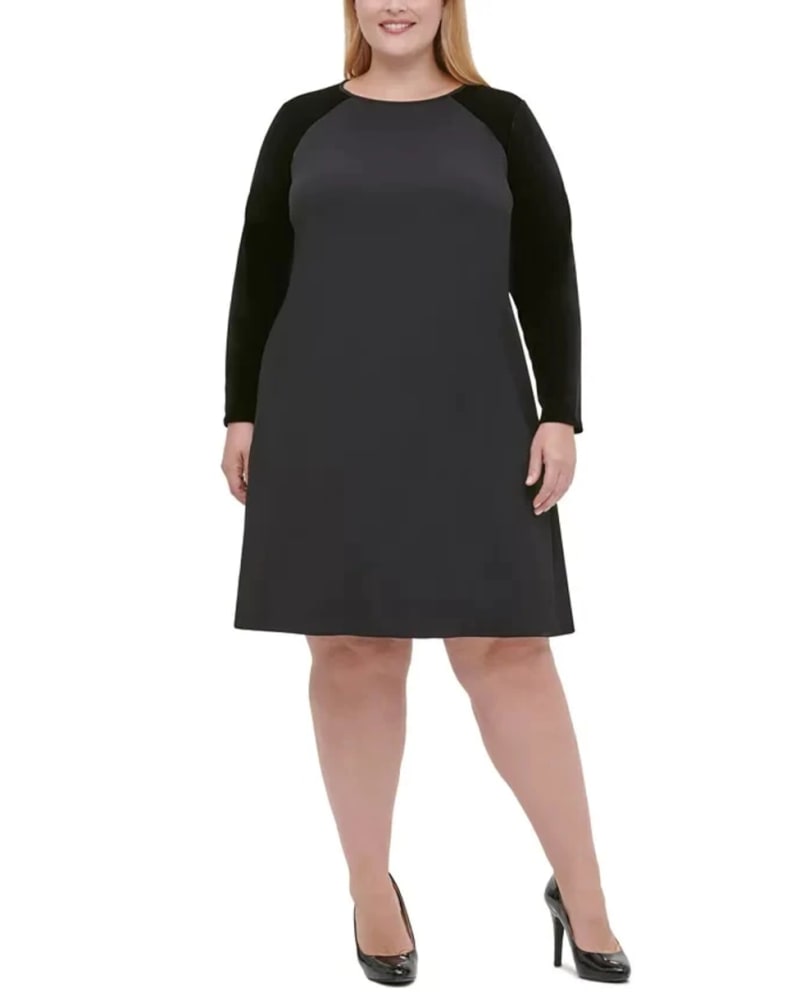 Front of a model wearing a size 18 Tommy Hilfiger Women's Plus Size Velvet-Sleeve A-Line Dress Black Size 18 in Black by Tommy Hilfiger. | dia_product_style_image_id:313494